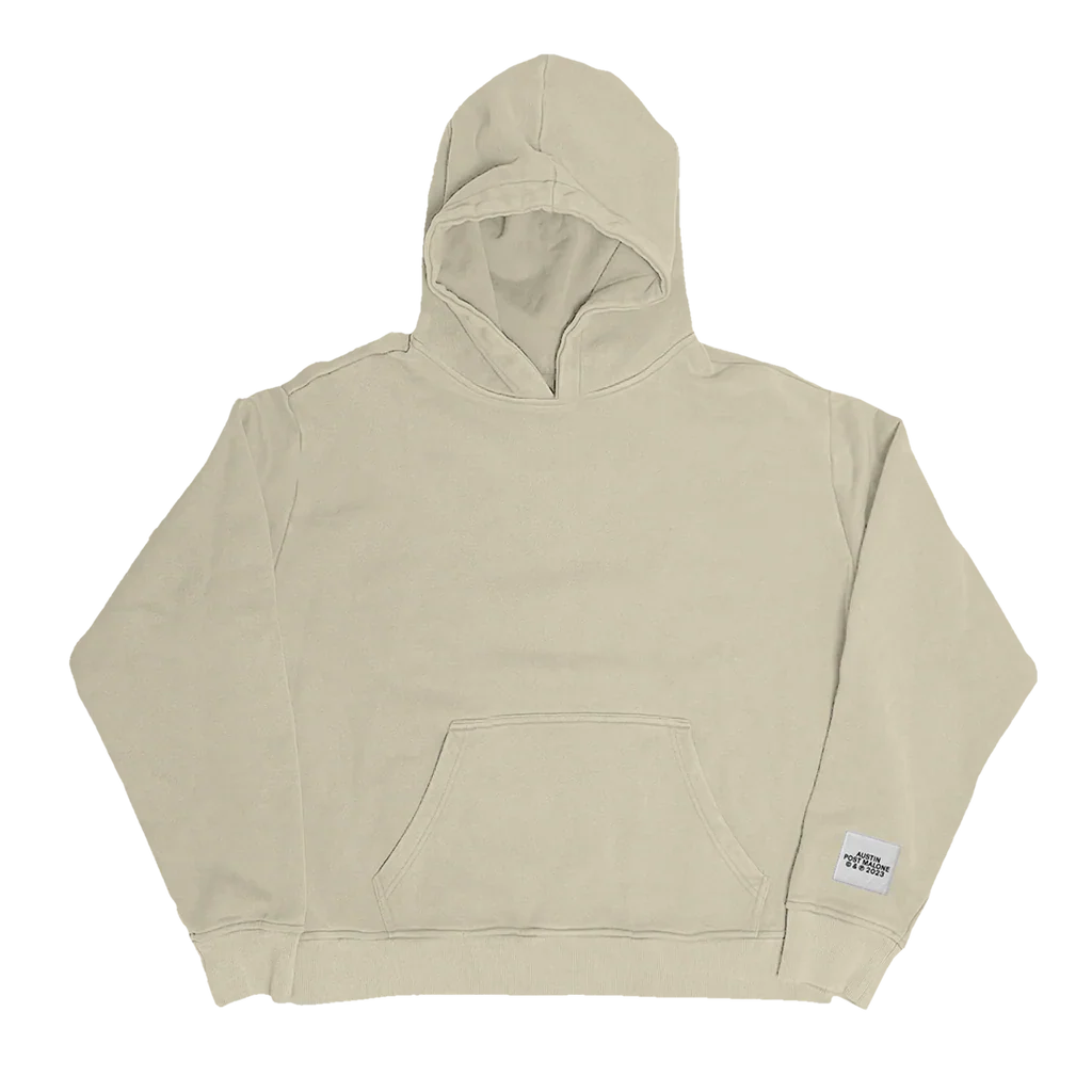 Front view of beige Post Malone Austin streetwear hoodie featuring minimalist oversized fit with neutral-toned premium merch aesthetic