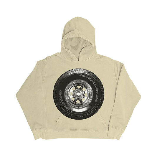 Front view of cream Post Malone hoodie featuring oversized tire graphic inspired by F-1 Trillion streetwear aesthetic