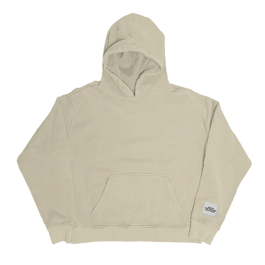 Front view of beige Post Malone Austin streetwear hoodie featuring minimalist oversized fit with neutral-toned premium merch aesthetic