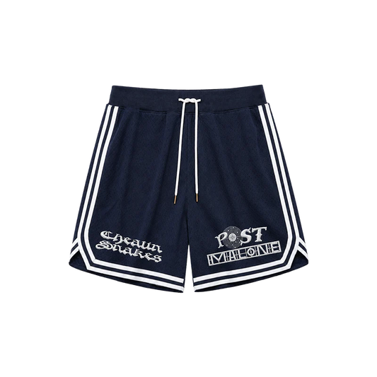 Front view of navy Post Malone x Cheatin Snakes mesh shorts with white piping, drawstring, and embroidered logo graphics.