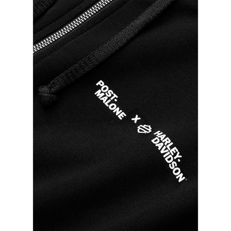 Close-up of black Post Malone x Harley-Davidson hoodie sleeve with white logo print and biker-inspired design