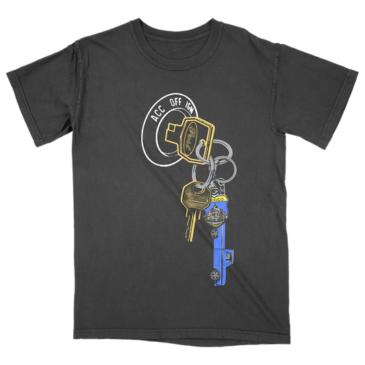 Black Post Malone merch t-shirt featuring vintage keychain graphic artwork and F-1 Trillion inspired streetwear design.