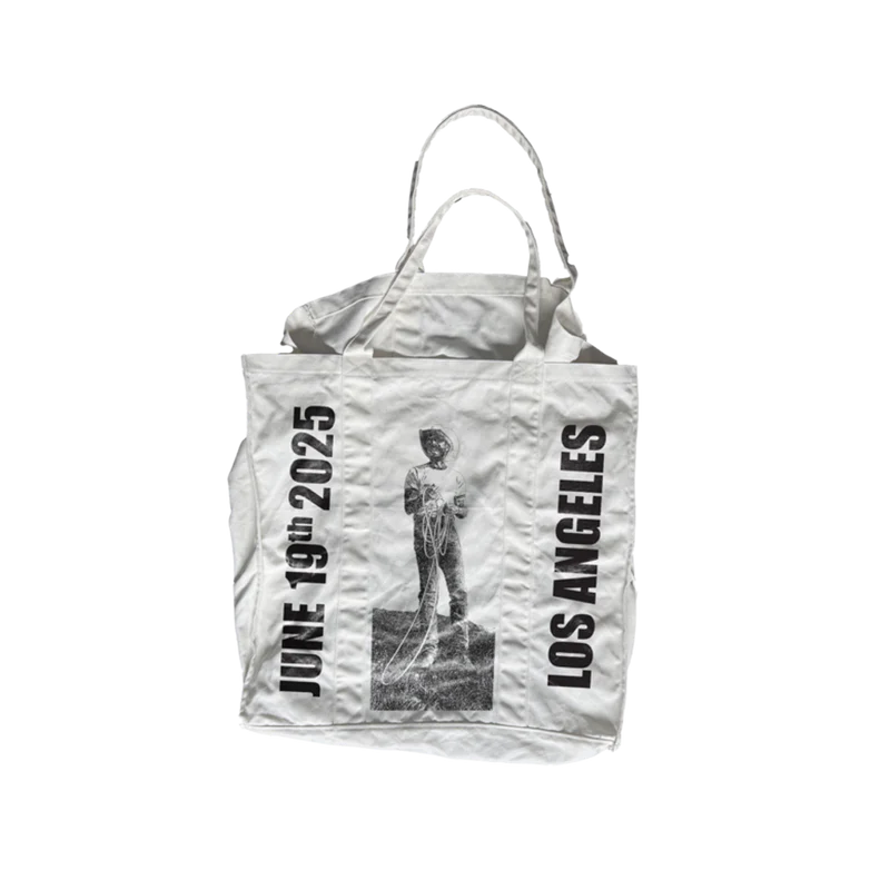 Cream Post Malone merch tote bag with cowboy rope graphic and Los Angeles text design on back official fan apparel