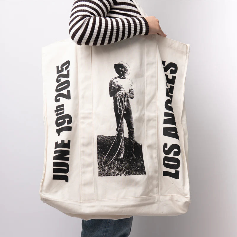 Large cream Post Malone merch tote bag featuring cowboy rope graphic and Los Angeles tour design worn streetwear apparel